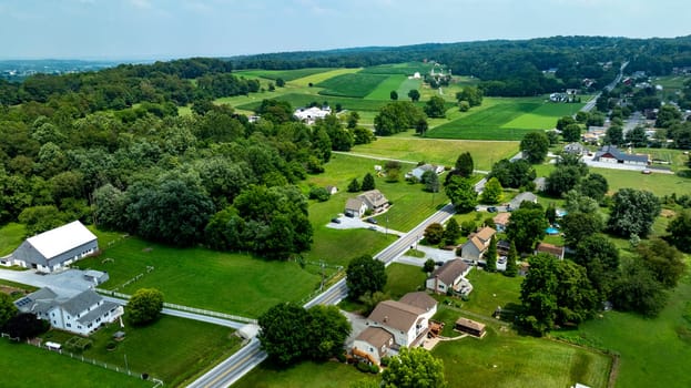 An Aerial View of Rural Homes and Farmland in Countryside