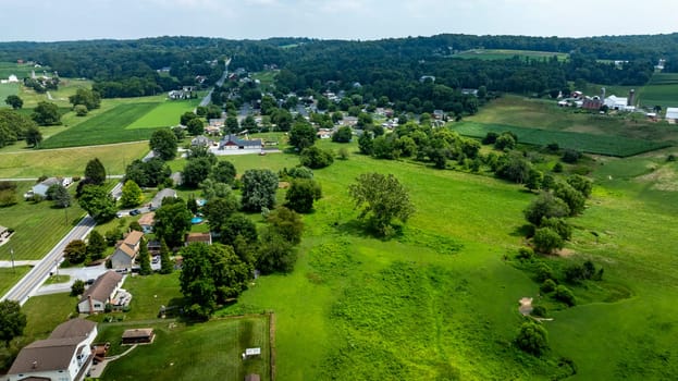 An Aerial View of Rural Community and Surrounding Farmlands