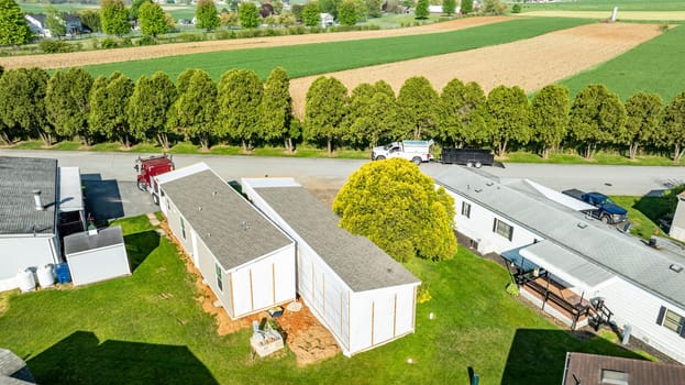 Aerial View of a Manufactured, Mobile, Prefab Home Being Removed from a Lot in a Park