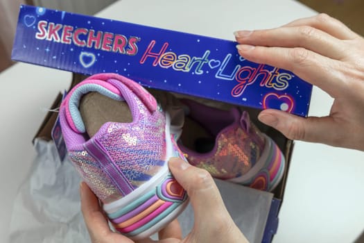 Children's sports shoes. New fashion Skechers sneakers for children in box. Denmark - November 13, 2023