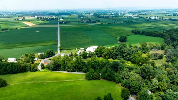 An Aerial View of Expansive Farmlands and Country Roads