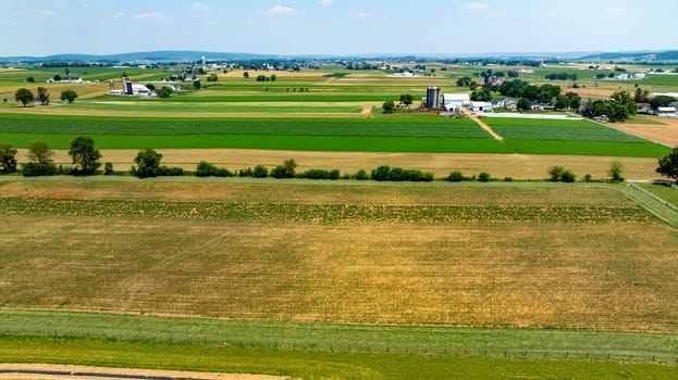 An Aerial View of Farmland with Varied Crops and Fields