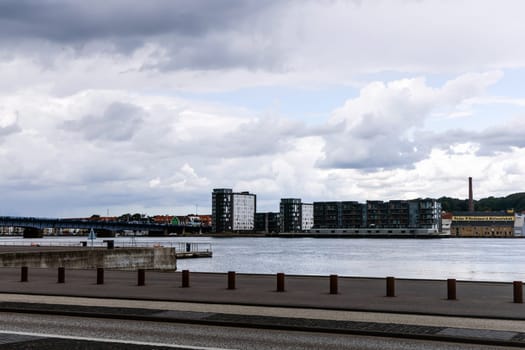 Cloudy weather in the city. Waterfront of the Danish city of Aalborg, Denmark - Oktober 01, 2023.