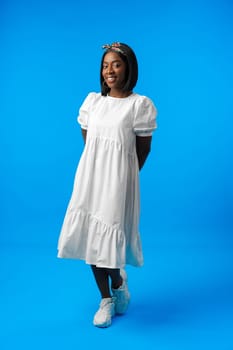 Full length portrait of a beautiful young african woman posing in photostudio close up