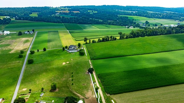 An Aerial View of Farmland and Country House in Countryside