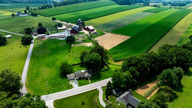 An Aerial View of a Countryside Farm with Green Fields