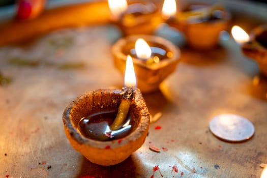 Organic diya lamps made from coconut fiber filled with oil and lit to celebrate the hindu festival of diwali the victory of good over evil in India