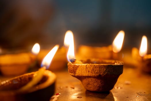 Organic diya lamps made from coconut fiber filled with oil and lit to celebrate the hindu festival of diwali the victory of good over evil in India