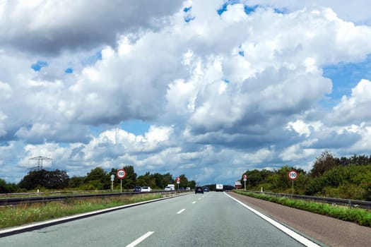 Highway with cars on a cloudy summer day. High quality photo