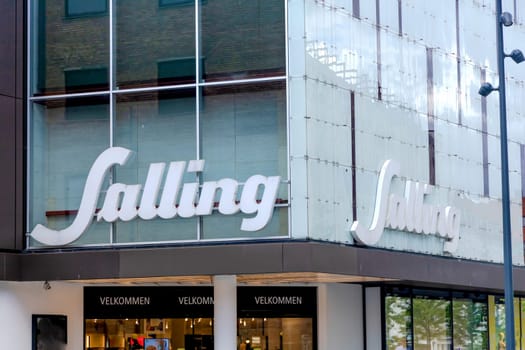 Salling shopping center building with a large signboard. Aalborg, Denmark - Oktober 01, 2023 .