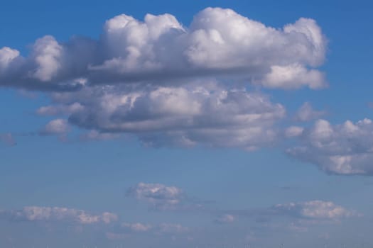 Line of Puffy cloud in blue sky . High quality photo