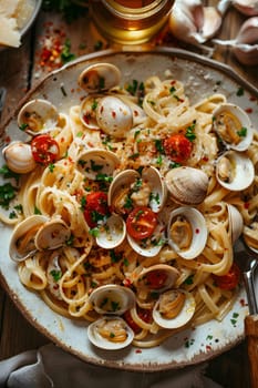 A delicious dish of spaghetti with clams and tomatoes served on a table. Ingredients include fresh clams, ripe tomatoes, spaghetti noodles, and a squeeze of lemon for added flavor