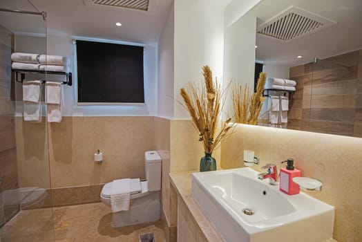 Interior design of a luxury show home bathroom with shower cubicle and sink