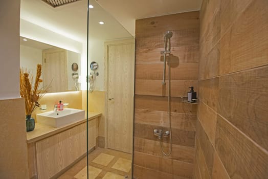 Interior design of a luxury show home bathroom with shower cubicle and sink