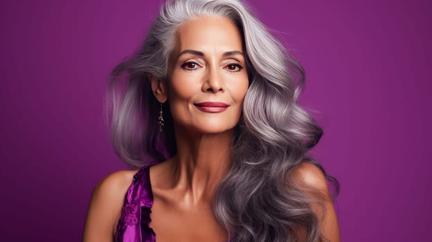 Elegant, elderly, chic latino, Spain woman with gray long hair and perfect skin, purple background, banner. Advertising of cosmetic products, spa treatments, shampoos and hair care products, dentistry and medicine, perfumes and cosmetology for women