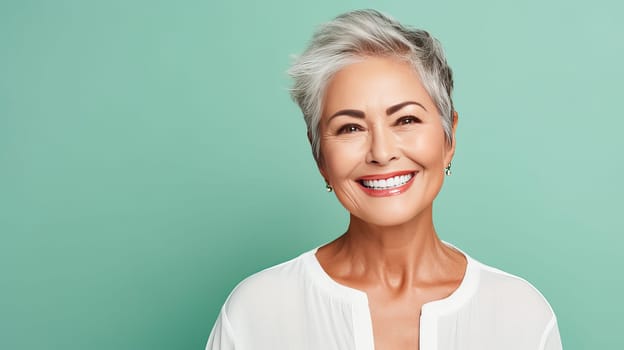 Elegant, smiling elderly, chic latino, Spain woman with gray hair and perfect skin, green background banner. Advertising of cosmetic products, spa treatments, shampoos and hair care products, dentistry and medicine, perfumes and cosmetology for women