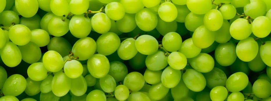 Close up of raw organic sweet green grapes background, wine grapes texture