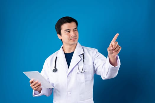 Smart doctor holding transparent tablet searching disease research data with pointing in futuristic technology for remedy therapy healthcare innovation interface hologram monitor screen. Contrivance.