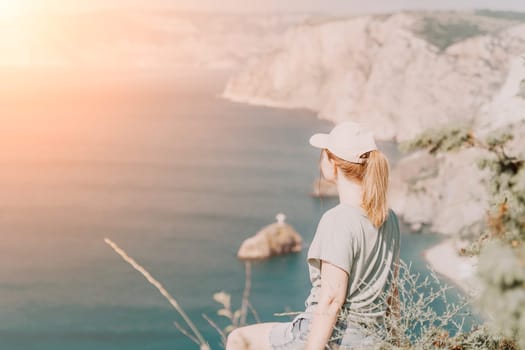 Woman travel sea. Happy carefree sensual woman with long hair in black swimwear posing at sunset beach. Silhouette of young beautiful playful positive woman outdoor. Summer vacation and trip concept