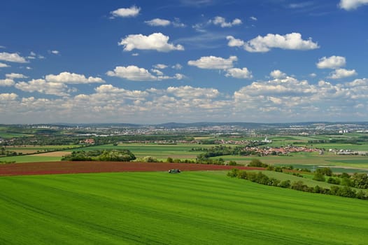 Beautiful landscape in the Czech Republic. Green nature with blue sky and sun.