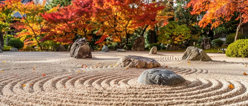 A Zen garden's tranquil setting is accentuated by the warm fall colors, inviting a moment of peace amid the raked sand and stone arrangements.