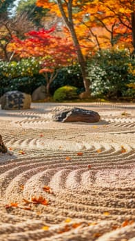 Sun-kissed and vibrant, the meticulously arranged Zen garden reflects the splendor of autumn with its patterns of raked sand among colorful leaves.