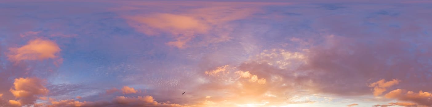 Dramatic Sunset sky 360 panorama. Vibrant sky with bright glowing red pink Cumulus clouds. HDR 360 seamless spherical panorama. Sky dome for aerial drone panoramas. Climate and weather change