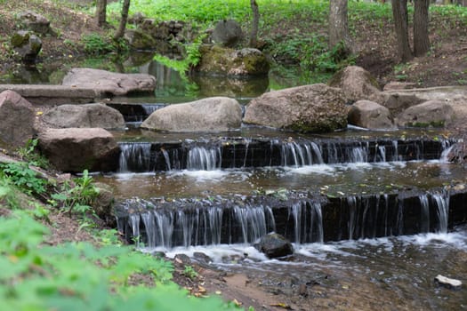 small artificial waterfall in the park.