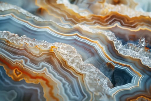 Striped agate rock closeup view with orange, yellow and white colors for nature and healing crystal concepts