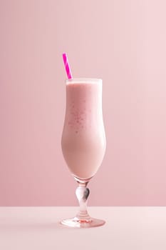 Strawberry milkshake in a glass on a pink background. The concept of summer soft drinks. Generative AI