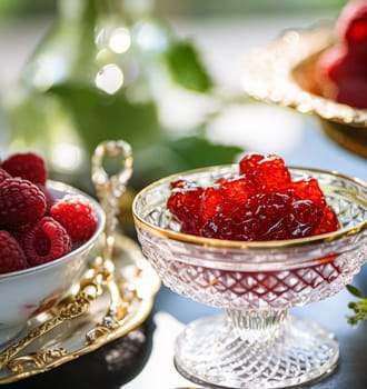 Raspberry jam and raspberries in a crystal bowl, country food and English recipe idea for menu, food blog and cookbook inspiration