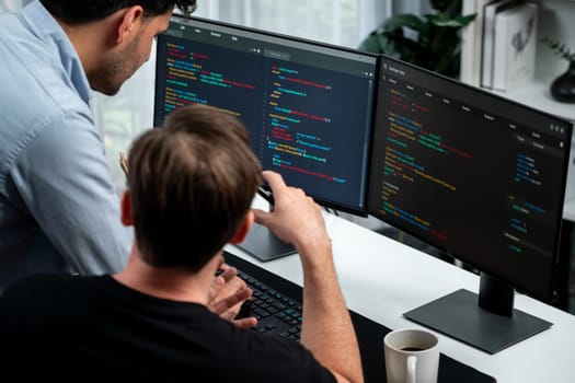 IT developers discussing online software development information on pc screen, creating program coding for latest version application on website. Concept of brainstorming firmware updated. Sellable.