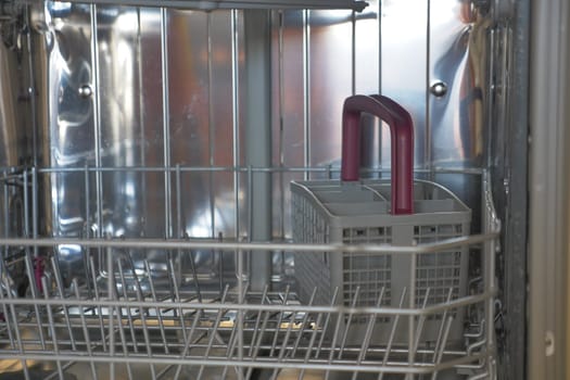 Front view of empty dishwasher. High quality photo