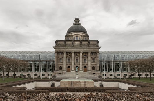 Munich, Germany - Dec 21, 2023 - Architecture exterior of Bayerische Staatskanzlei is a government building with Monument in front of entrance. Bavarian State Chancellery building (the former Bayerische Armeemuseum, Bavarian Army museum), Space for text, Selective focus.