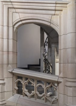 Munich, Germany - Dec 21, 2023 - Gothic architectural style with arches of famous New Town Hall (Neues Rathaus) on Marienplatz square in Munich. Beautiful Corridor with Staircase and Pillars, Space for text, Selective focus.