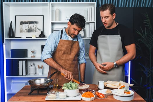 Healthy influencers presenting fresh salad roll power on cooking show, displaying ingredients of diversity vegetables and homemade soft tortilla wrap on table. Channel on social media live. Sellable.