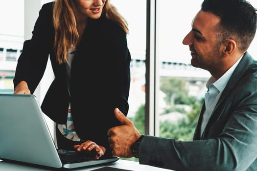 Businessman executive is in meeting discussion with a businesswoman worker in modern workplace office. People corporate business team concept. uds