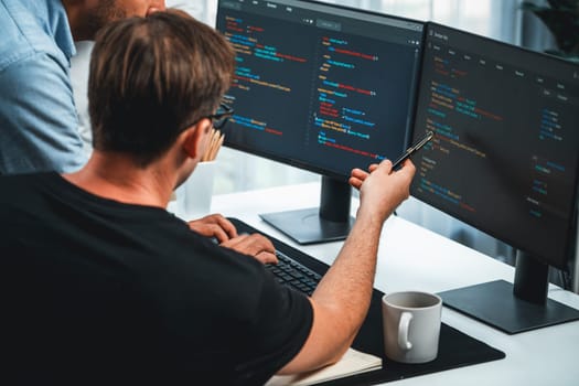 IT developers discussing online software development information on pc screen, creating program coding for latest version application on website. Concept of brainstorming firmware updated. Sellable.