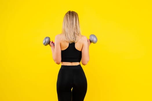 Middle aged woman doing fitness workout, standing on activewear with abs and muscles, smiling happy