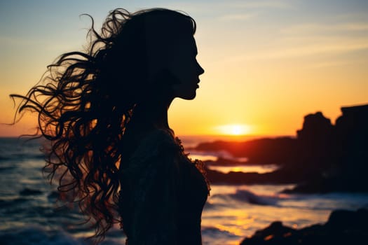 Stunning double exposure of womans silhouette with amazing ocean sunset in background