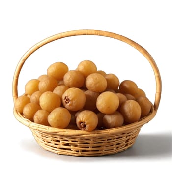 Dried longan slices in a mesmerizing wicker basket pale brown with a smooth interior. Food isolated on transparent background.