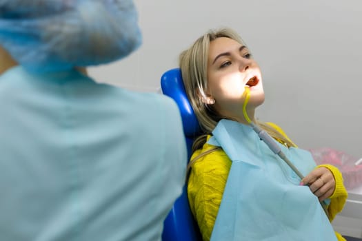 Dental health concept. female mouth on treatment in a dental clinic