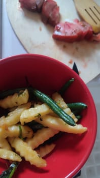 red bowl, fork chips food dinner. High quality photo