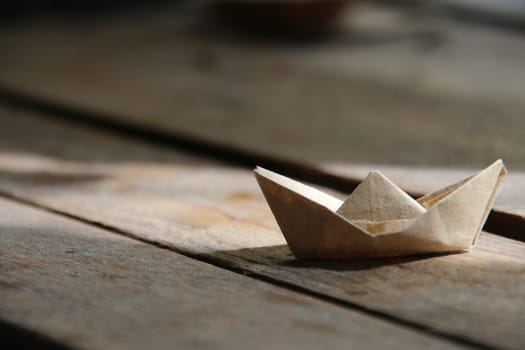 Leadership creative Concept. Paper boat on the table. Summer time idea.