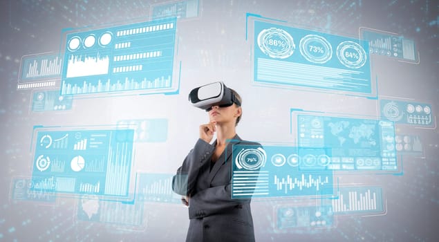 Smart business woman making decision while looking at data by using VR glasses while wearing suit and visual reality. Project manager thinking about investment while planning strategy. Contraption.