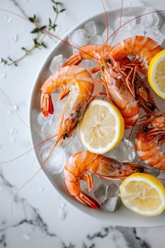 Fresh shrimps with lemon slices on a white plate on a marble countertop for seafood lovers