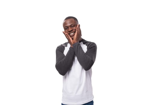 young smiling happy businessman american man dressed casual on studio background.