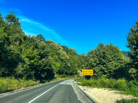 Road sign of the town "Banja Luka", near the forest on a summer day, Bosnia