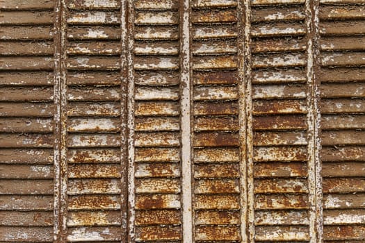 A detailed view of a rusty train track with visible metal texture and corrosion.