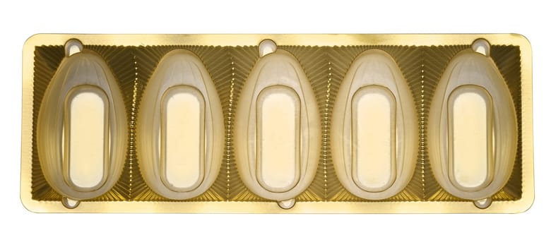 Insert for individual candy. The shape of the recesses is oval, with smooth edges and protrusions for fixing candies on an isolated background, top view